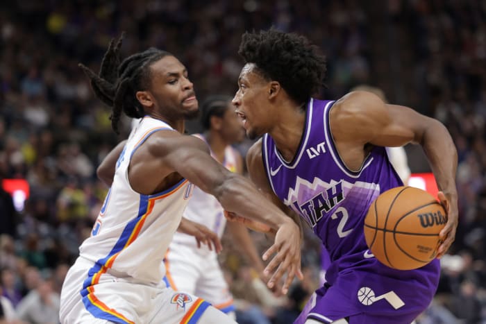 Jan 18, 2024; Salt Lake City, Utah, USA; Utah Jazz guard Collin Sexton (2) protects the ball from Oklahoma City Thunder guard Cason Wallace (22) during the second half at Delta Center.